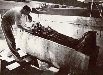 Carter removes the shroud from the second coffin of King Tut